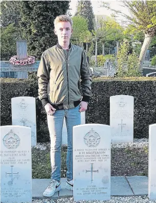  ?? COURTESY OF MATTHIJS ZWAAL ?? Matthijs Zwaal, 16, at the grave of Ken Masterson, shot down over Nazi-occupied Holland in 1943.