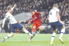  ?? - AFP photo ?? Liverpool's Brazilian midfielder Roberto Firmino (2L) shoots but sees his shot saved during the English Premier League football match between Tottenham Hotspur and Liverpool at Tottenham Hotspur Stadium in London, on January 11, 2020.