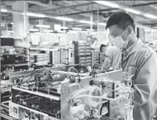  ?? PROVIDED TO CHINA DAILY ?? Mindray employees put finishing touches to medical equipment at a factory in Shenzhen, Guangdong province, in February.