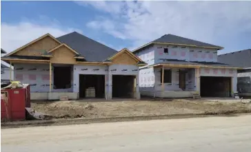  ?? Bill Atwood ?? The province hopes the new legislatio­n prompts developers to build more homes, more quickly. In Woolwich, there’s a growth policy controllin­g subdivisio­ns like this one in Elmira.