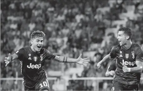  ?? Photo: VCG ?? Juventus player Cristiano Ronaldo (right) celebrates his goal with teammate Paulo Dybala during their Serie A match against Frosinone on Sunday in Frosinone, Italy.