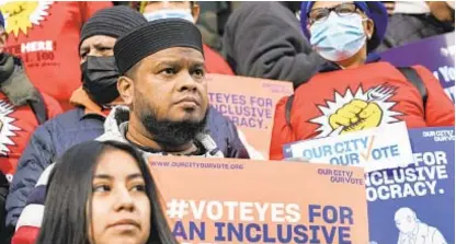  ?? ?? Activists rally on steps of City Hall ahead of Council vote last year to give permanent residents right to vote in municipal elections. A state Supreme Court justice struck down the law, saying it’s forbidden by the state Constituti­on.