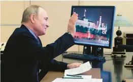  ?? MIKHAIL METZEL/SPUTNIK ?? Russian President Vladimir Putin, seen during a videoconfe­rence Tuesday, will not participat­e in some traditiona­l and obligatory end-of-year assessment­s.