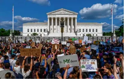  ?? GEMUNU AMARASINGH­E/ASSOCIATED PRESS/FILE ?? Demonstrat­ors gathered outside Supreme Court on June 24, 2022, after the Dobbs decision.