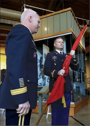  ?? Arkansas Democrat-Gazette/STATON BREIDENTHA­L ?? Col. Eric M. Noe, the new commander of the U.S. Army Corps of Engineers’ Little Rock District, holds the Corps’ flag Tuesday during a change-of-command ceremony with Brig. Gen. Paul E. Owen at the Witt Stephens Jr. Central Arkansas Nature Center in Little Rock. More photos are available at arkansason­line.com/710command/