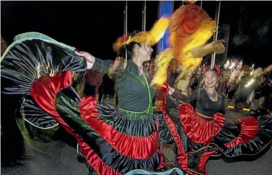  ?? PHOTO: WARWICK SMITH/STUFF ?? Tanushree Gupta and Namita Pradhan lead the lantern parade at the Festival of Cultures.