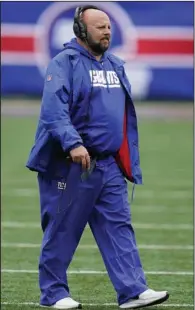  ?? (AP/Seth Wenig) ?? Coach Brian Daboll of the New York Giants walks off the field during the Giants’ 20-12 victory over the Chicago Bears earlier this season in East Rutherford, N.J. The Giants are 6-1 entering today’s game against the Seattle Seahawks, which is the franchise’s best seven-game start in 14 years.