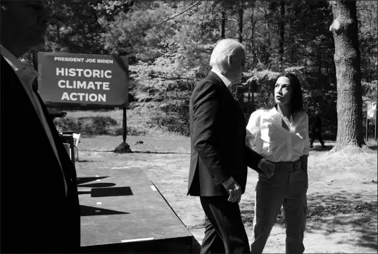  ?? MANUEL BALCE CENETA / ASSOCIATED PRESS ?? President Joe Biden and Rep. Alexandria Ocasio-cortez, D-N.Y., talk April 22 at Prince William Forest Park in Triangle, Va.