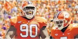  ?? TODD BENNETT/GETTY IMAGES ?? A junior, defensive tackle Dexter Lawrence, left, is already involved in top of the NFL draft talk for when he declares.