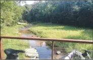  ?? NWA Democrat-Gazette/FLIP PUTTHOFF ?? Overlooks allow nice views of Coler Creek along the trail. There’s access to the stream for people who want to play in the water.