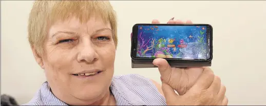  ?? Picture: Chris Davey ?? Heather Mead who has developed an app based around tracking fish which has been designed to focus the mind and improve cognitive skills. She hopes it will help those with dementia