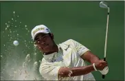  ?? MATT SLOCUM — THE ASSOCIATED PRESS ?? Winner Hideki Matsuyama watches his ball out of a bunker during the final round of the Masters tournament Sunday.