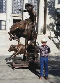  ?? ?? Cowboy in a Storm at the Yavapai County Courthouse Plaza with George Phippen’s son, Darrell Phippen.