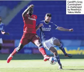  ??  ?? Cardiff’s Greg Cunningham is challenged by Reading’s Yakou Meite