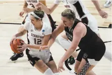  ?? Morry Gash / Associated Press ?? Stanford’s Lexie Hull grabs a loose ball in front of Missouri State’s Emily Gartner during the second half in San Antonio.