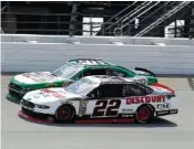  ?? THE ASSOCIATED PRESS ?? Paul Menard (22) and Kevin Harvick compete during the NASCAR Xfinity Series race Saturday afternoon at Chicagolan­d Speedway in Joliet, Ill. Menard later qualified first for today’s Cup Series race at the track.