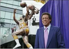  ?? REED SAXON — THE ASSOCIATED PRESS FILE ?? Elgin Baylor stands next to a statue honoring the Minneapoli­s and Los Angeles Lakers great, outside Staples Center in Los Angeles, in this April 6, 2018, file photo. Baylor died Monday at age 86.