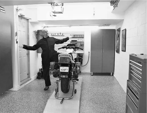  ?? Chris balc erak for National Post ?? David Booth couldn’t be happier as he shows off his renovated garage, complete with a gleaming new floor and cabinets.