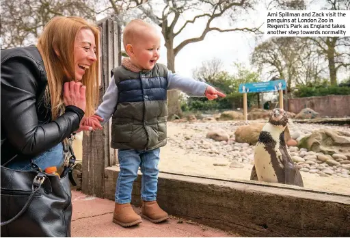  ??  ?? Ami Spillman and Zack visit the penguins at London Zoo in Regent’s Park as England takes another step towards normality