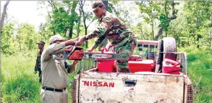  ?? FACEBOOK ?? Officers seized a chainsaw while inspecting state forest land in Siem Reap province on Saturday.
