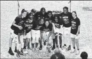  ?? Julio Aguilar / Getty Images ?? The Seattle Storm poses after winning the WNBA championsh­ip Tuesday night with a 92-59 rout of the Las Vegas Aces in Bradenton, Fla.