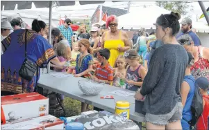  ?? NIKKI SULLIVAN PHOTOS/ CAPE BRETON POST ?? People enjoy games of chance at the 32nd annual Caribbean Festival put on by St. Philip’s African Orthodox Church on Monday.