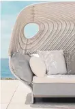  ?? FOTO: DEDON/DPA ?? Spezielle Outdoor-Sofas haben ein Dach – und wirken gemütlich wie kleine Höhlen.