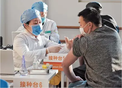  ??  ?? People get vaccinated in a community health center in Beijing’s Xicheng District. — Xinhua