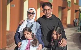  ?? PROVIDED BY REFUGEES INTERNATIO­NAL ?? Nuha Bashir with her husband, Ahmed, and their twin daughters in Cairo in January after fleeing the Gaza Strip.