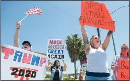  ??  ?? Breanna Marino, Vangie Boschee and Teri Eister, longtime Lodi small business owner, support the Open Lodi protest in Lodi on Saturday.