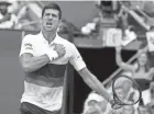  ?? AP ?? Novak Djokovic reacts after scoring a point against Kei Nishikori during their third-round U.S. Open match Saturday. Djokovic won, 6-7 (4), 6-3, 6-3, 6-2.