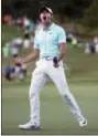  ?? JOHN BAZEMORE — THE ASSOCIATED PRESS ?? Rory McIlroy reacts after sinking a putt on the fourth hole of a playoff with Kevin Chappell to win the Tour Championsh­ip golf tournament and the FedEx Cup at East Lake Golf Club, Sunday in Atlanta.