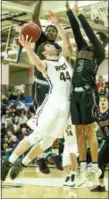  ?? JIM TRYON/FOR DIGITAL FIRST MEDIA ?? CB West’s Jake Reichwein goes up for a bucket in between Roman Catholic defenders Saturday.