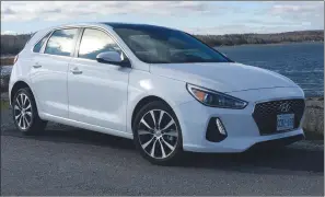  ?? ?? The 2018 Hyundai Elantra GT starts at $22,799 for the base model. (Richard Russell).