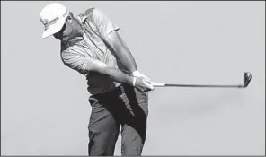  ?? AP/Florida Times-Union/TERRY DICKSON ?? Brian Gay hits a shot onto the 18th green during Thursday’s first round of the PGA McGladrey Classic in St. Simons Island, Ga. Gay shot a 63 and shares the lead with Briny Baird, but a two-hour fog delay kept 54 players from finishing their rounds...