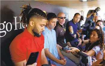  ?? K.C. ALFRED U-T ?? Padres’ Fernando Tatis Jr., sitting alongside General Manager A.J. Preller, speaks with the media on Aug. 23, a day he spent apologizin­g to his teammates and then to the world for his actions involving PEDS.