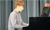  ?? ?? Jamie SawadaMill­er performs Grade 2 Piano on the Grotrian grand piano.