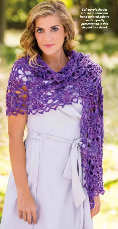  ??  ?? Soft purple shades infused in a luscious hand-painted palette create a pretty presentati­on in this elegant lace shawl.