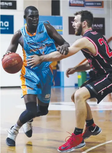  ?? Pictures: STEWART McLEAN, KRIS REICHL ?? SUCCESS STORY: Taipans rookie Kuany Kuany in action for the Cairns Marlins against the Mackay Meteors in the QBL; and (below) his early mentor Manyang Berberi.