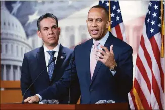  ?? Jose Luis Magana / Associated Press ?? Rep. Hakeem Jeffries, D-N.Y., joined by Rep. Pete Aguilar, D-Calif., speaks to reporters after they were elected by House Democrats to form the new leadership when Speaker of the House Nancy Pelosi, D-Calif., steps aside in the new Congress under the Republican majority.