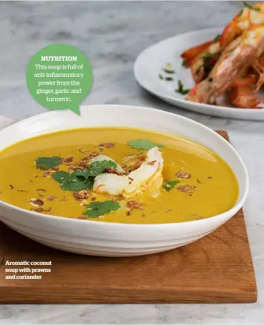  ??  ?? NUTRITION This soup is full of anti-inflammato­ry power from the ginger, garlic and turmeric. Aromatic coconut soup with prawns and coriander