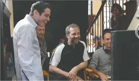  ?? UNIVERSAL PICTURES ?? Actor Pete Davidson, left, and director Judd Apatow blur the lines of true life and satire in the new film The King of Staten Island.