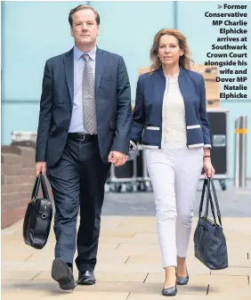  ??  ?? > Former Conservati­ve MP Charlie Elphicke arrives at Southwark Crown Court alongside his wife and Dover MP Natalie Elphicke