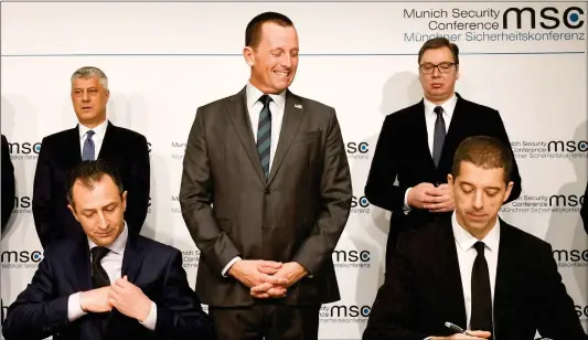  ?? Photo: AFP ?? US Ambassador to Germany Richard Grenell (center) gestures during the signing of an agreement between Kosovo and Serbia for railway and street projects at the Munich Security Conference in Munich, southern Germany, on February 14.