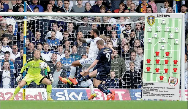  ?? PICTURES: Media Image ?? CAPTAIN FANTASTIC: Kyle Bartley scores to make it 1-0 to Leeds