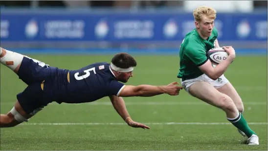  ??  ?? Captain Alex Samuel attempts to tackle Ireland’s Jamie Osborne in Scotland’s 38-7 Six Nations defeat in Cardiff