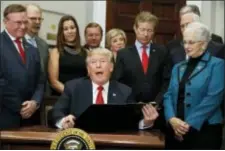  ?? EVAN VUCCI - THE ASSOCIATED PRESS ?? In this Oct. 12 file photo, President Donald Trump speaks before signing an executive order on health care in the Roosevelt Room of the White House in Washington. An Associated Press analysis finds that Americans in states President Donald Trump...