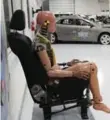  ??  ?? The dummy is king at IIHS. This one takes a break between crashes.