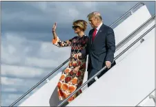  ?? MANUEL BALCE CENETA — THE ASSOCIATED PRESS ?? Former President Donald Trump and Melania Trump wave as they disembark from their final flight on Air Force One at Palm Beach Internatio­nal Airport in West Palm Beach, Fla., Wednesday, Jan. 20, 2021.