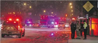  ?? JEAN LEVAC ?? Emergency crews battle road conditions with other motorists to respond to a fire on Albert Street.